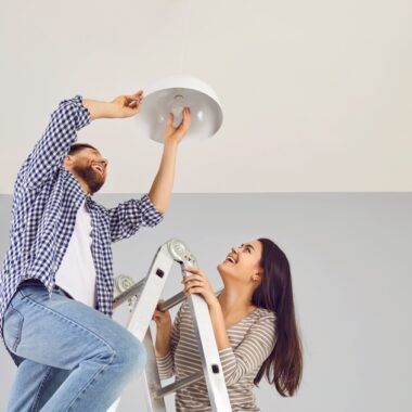 a couple renovating a house before selling